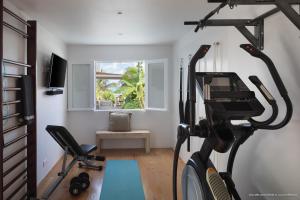 a room with a gym with a treadmill at On the Beach , in Saint Barth... Mellow Mood Villa in Saint Barthelemy