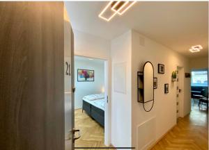 a small bedroom with a bed and a hallway at Freshly renovated Apartment in Trendy Area! HG21 in Vienna