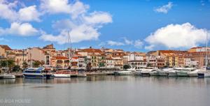 a group of boats docked in a harbor with buildings at Bga Rentals Garbi in Cambrils