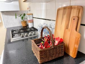 a basket of peppers sitting on a counter in a kitchen at 3BR Central London close Station in London