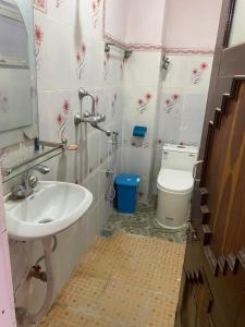 a bathroom with a sink and a toilet at Himalayan Vacation Home in Kathmandu
