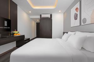 Postelja oz. postelje v sobi nastanitve Mercy Emerald Hotel