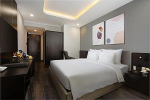 Postelja oz. postelje v sobi nastanitve Mercy Emerald Hotel