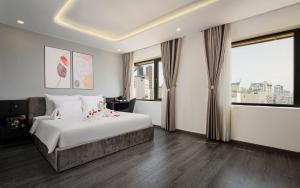 Postelja oz. postelje v sobi nastanitve Mercy Emerald Hotel