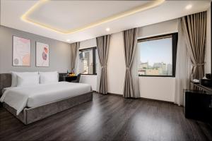 Postelja oz. postelje v sobi nastanitve Mercy Emerald Hotel