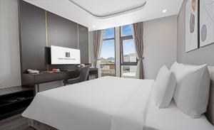 Postelja oz. postelje v sobi nastanitve Mercy Emerald Hotel