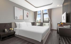 Postelja oz. postelje v sobi nastanitve Mercy Emerald Hotel