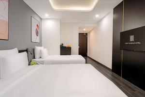 Postelja oz. postelje v sobi nastanitve Mercy Emerald Hotel