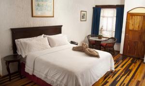 Cama ou camas em um quarto em Eco-hotel El Rey del Caribe mais 37 fotos