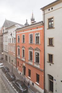a group of buildings on a city street at Harmony Studio by LoftAffair in Krakow