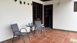 a table and chairs sitting on a patio at Villa Estrella Polar in Tahiche