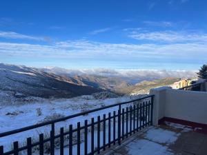 a balcony with a view of a snow covered mountain at Apartamento Rodrinsur Edificio Ginebra con Parking Privado in Sierra Nevada