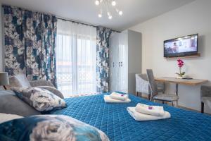 Posteľ alebo postele v izbe v ubytovaní Apartament 38 i 37 Okrzei 1c