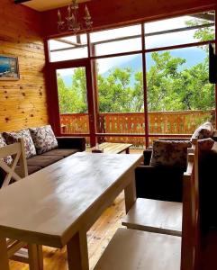a living room with a couch and a table at Verin Tun in Dilijan