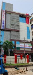 a building with red and blue windows in a city at The Royal Comforts in Visakhapatnam