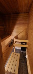 an inside of a sauna with a bench in it at Moderni kaksio Kuopion keskustassa in Kuopio