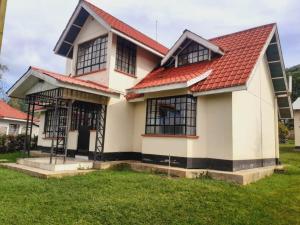 a house with a red roof at Accommodation in Vihiga Bnb in Koiparak