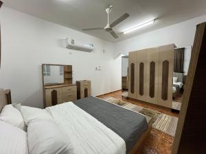 מיטה או מיטות בחדר ב-Relaxation Oasis