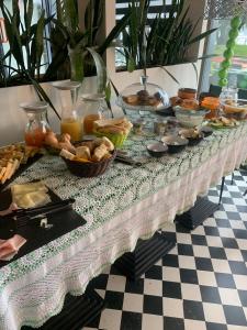 a buffet of food on a black and white table at Seven boutique hotel in Sestri Levante