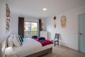 Ένα ή περισσότερα κρεβάτια σε δωμάτιο στο Palapa Beach Paradise