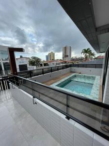a swimming pool on the roof of a building at APT Moderno na melhor Localização de João Pessoa! in João Pessoa
