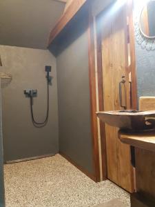 a bathroom with a sink and a shower at Chalupa Řeka - Na samotě u lesa in Řeka