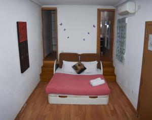A bed or beds in a room at Estudio Nueva Numancia