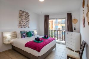 Ένα ή περισσότερα κρεβάτια σε δωμάτιο στο Palapa Beach Paradise