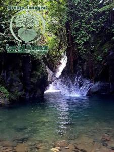 a picture of a waterfall in a river at Granja Integral Luz Del Corazon 