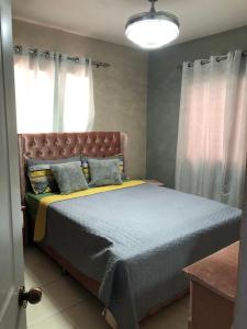 Кровать или кровати в номере Residencial Felipe 2