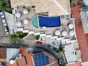 an overhead view of a swimming pool and a house at Sonia Flats Pipa's Bay - Flat 211 in Pipa