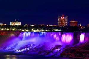 a view of the niagara falls at night at Exquisite, bright & modern condo. in Niagara Falls