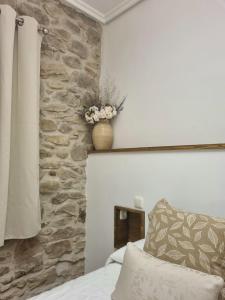 A bed or beds in a room at Casa Rural Betraunea