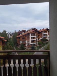 a balcony with a view of some apartment buildings at Apartment Wintermärchen Bansko 4* in Bansko