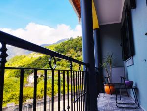 a balcony with a view of a mountain at Casa da Ribeira in Senhora do Rosário