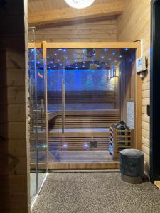 a room with a large glass door with a window at Blockhaus Kik im Harz in Sankt Andreasberg +60 photos