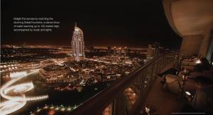 a view of a city at night from a building at Downtown Al Bahar Apartments in Dubai