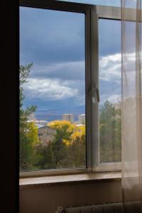 a window with a view of a city at Sevan Hotel in Sevan