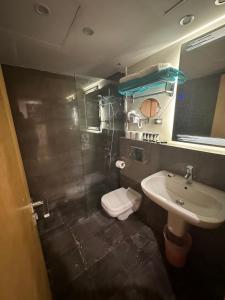 a small bathroom with a sink and a toilet at Scarab ES 03 GF One Bedroom Gouna in Hurghada