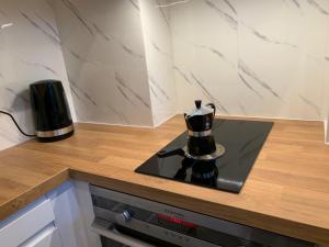 a coffee maker sitting on top of a counter at Charmante petite maison in Saint-Vigor-le-Grand +20 photos
