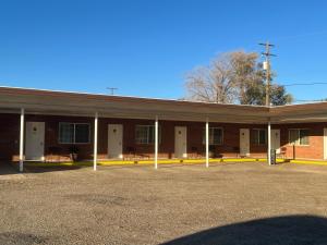 an empty parking lot in front of a building at DeLano Motel & RV Park Beaver in Beaver