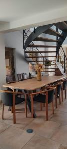 a dining room with a table and chairs at Villa Tauria- Casa de campo em aldeia medieval in Sabugal