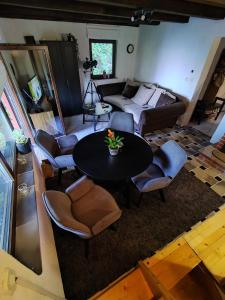 a living room with a table and chairs and a couch at Piece of Heaven in Samobor