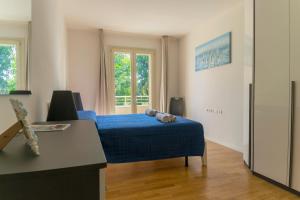 Postel nebo postele na pokoji v ubytování Grosseto Smart Stay Ingresso Privato, WiFi, Parcheggio & Self Check-in