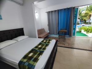 Katil atau katil-katil dalam bilik di Villas Playa Blanca