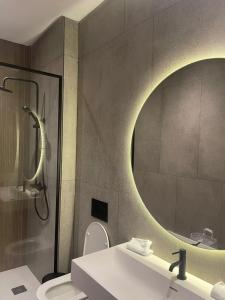 a bathroom with a sink and a mirror at Magic Appartement Luxury Gauthier 04 in Casablanca