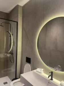 a bathroom with a sink and a mirror at Magic Appartement Luxury Gauthier 04 in Casablanca +26 photos