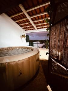 a large bath tub in a room with at Casa Bé-Bia in Carvalhal