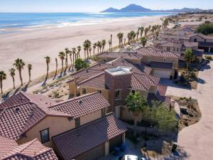 an aerial view of a resort with palm trees and the beach at El Dorado Ranch San Felipe Beach Condo 73-3 in La Ponderosa