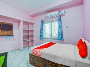 Postel nebo postele na pokoji v ubytování Hotel O Kalinga Inn